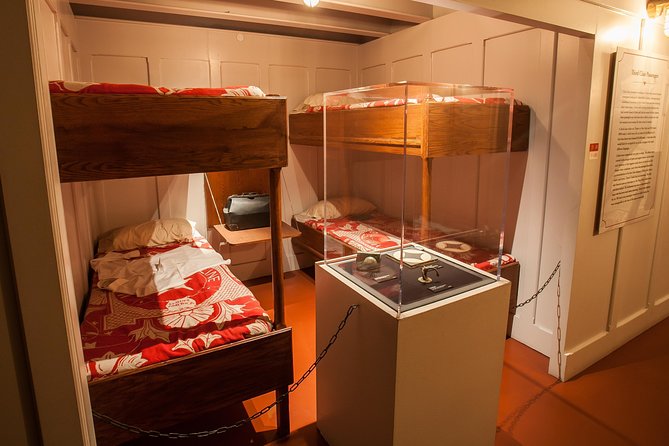 Titanic: The Artifact Exhibition at the Luxor Hotel and Casino - Reading the story in a dark, quiet setting